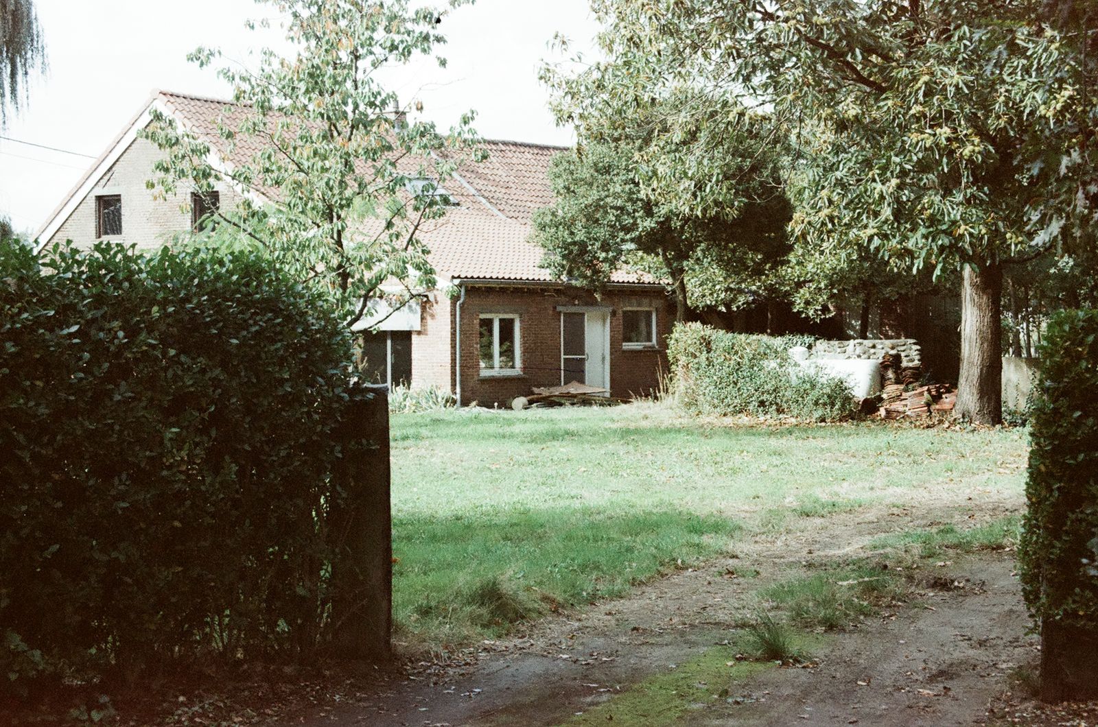 Rural home amid open grassland, illustrating properties that may need septic pumping