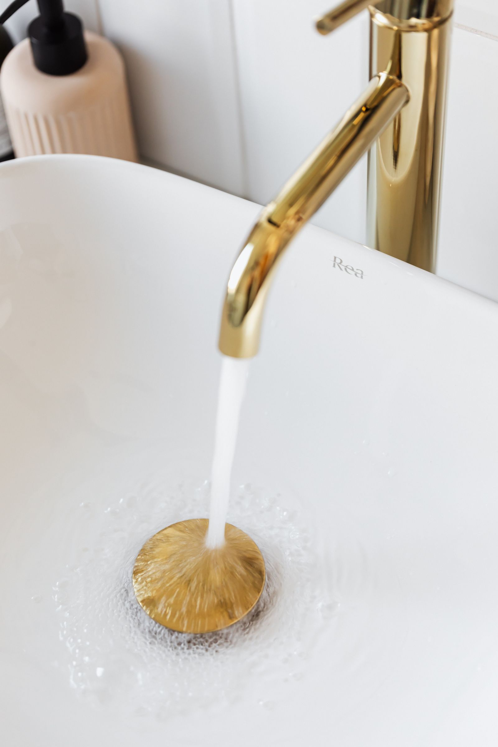 Water flowing from a faucet into a sink, illustrating restored household water after well pump repair